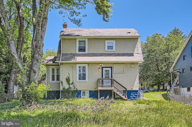 3203 Beverly Rd, Baltimore, MD 21214 - back of property featuring a chimney, brick siding, and roof with shingles
