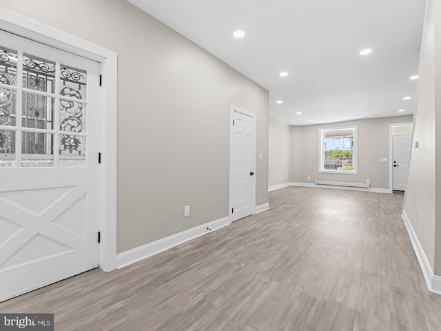 2223 W Indiana Ave, Philadelphia, PA 19132 - unfurnished room with a baseboard heating unit, wood finished floors, baseboards, and recessed lighting
