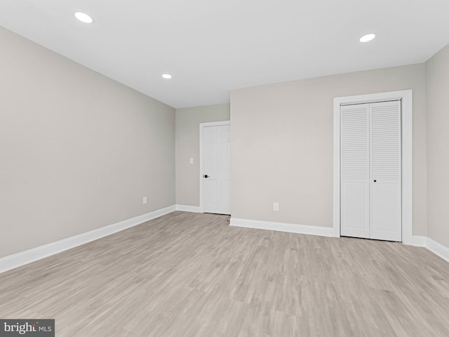 2223 W Indiana Ave, Philadelphia, PA 19132 - unfurnished bedroom featuring light wood-type flooring, baseboards, a closet, and recessed lighting