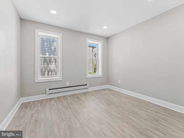 2223 W Indiana Ave, Philadelphia, PA 19132 - unfurnished room featuring baseboard heating, light wood-style floors, baseboards, and recessed lighting
