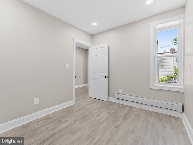 2223 W Indiana Ave, Philadelphia, PA 19132 - empty room with baseboard heating, baseboards, light wood-style floors, and recessed lighting