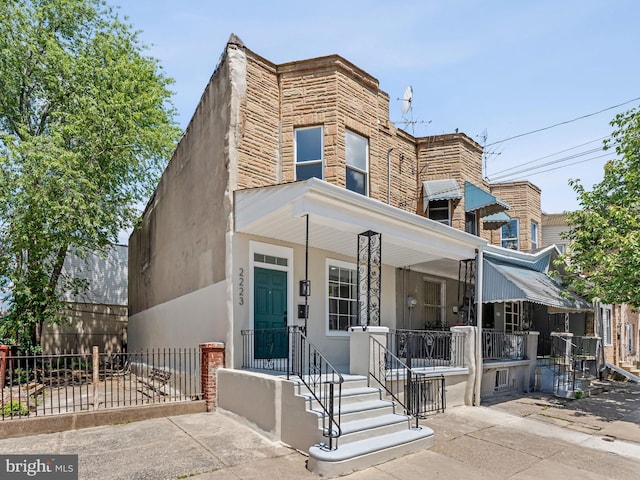 2223 W Indiana Ave, Philadelphia, PA 19132 - view of front of home featuring covered porch and stucco siding