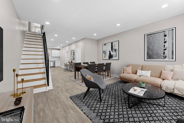 2223 W Indiana Ave, Philadelphia, PA 19132 - living room with light wood finished floors, stairway, recessed lighting, and baseboards