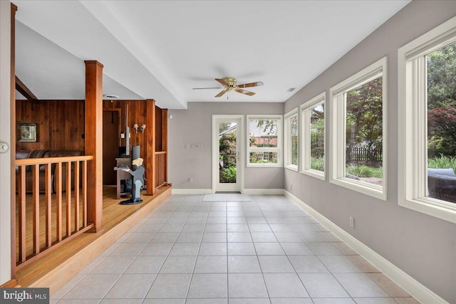 1 Birchall Dr, Haddonfield, NJ 08033 - unfurnished sunroom with tile patterned flooring, baseboards, and wood walls