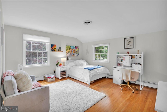 1 Birchall Dr, Haddonfield, NJ 08033 - bedroom with a baseboard heating unit, vaulted ceiling, and light wood-type flooring