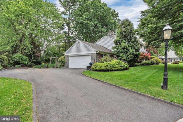 1 Birchall Dr, Haddonfield, NJ 08033 - view of front of house featuring asphalt driveway, a front lawn, a garage, and a chimney