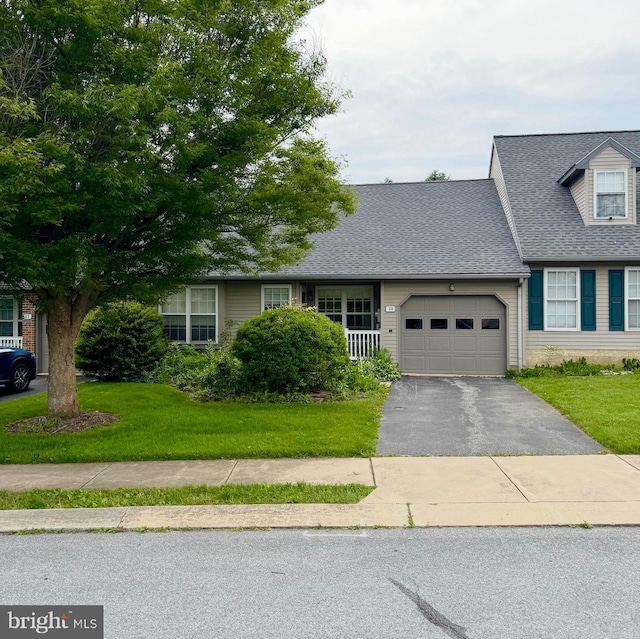 14 Burr Oak Dr, Millersville, PA 17551 - view of front of property with an attached garage, driveway, a front yard, and roof with shingles