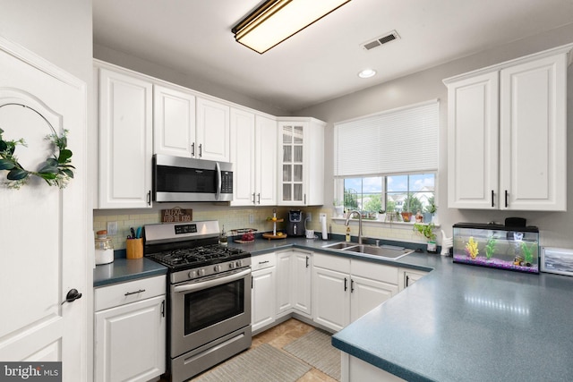 714 Kirkcaldy Way, Abingdon, MD 21009 - kitchen featuring stainless steel appliances, a sink, white cabinetry, backsplash, and dark countertops