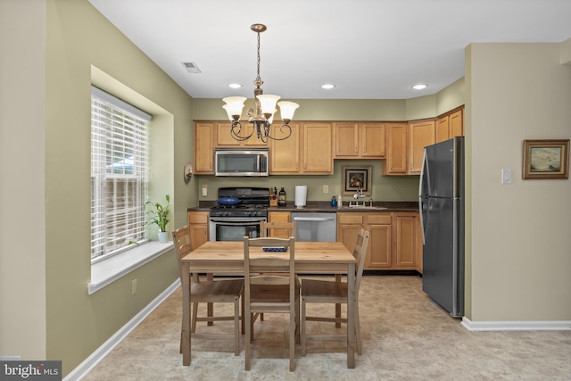 36 Kettlebrook Dr, Mount Laurel, NJ 08054 - kitchen featuring appliances with stainless steel finishes, a chandelier, dark countertops, a sink, and hanging light fixtures