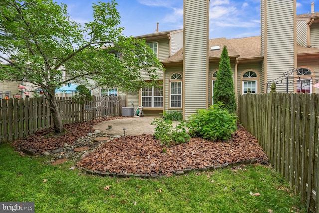 36 Kettlebrook Dr, Mount Laurel, NJ 08054 - back of property featuring a chimney, a patio area, central AC, and a shingled roof