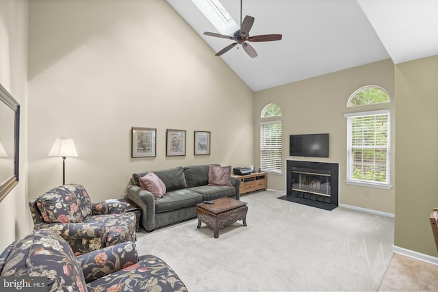 36 Kettlebrook Dr, Mount Laurel, NJ 08054 - living room featuring high vaulted ceiling, ceiling fan, a fireplace with flush hearth, light carpet, and baseboards