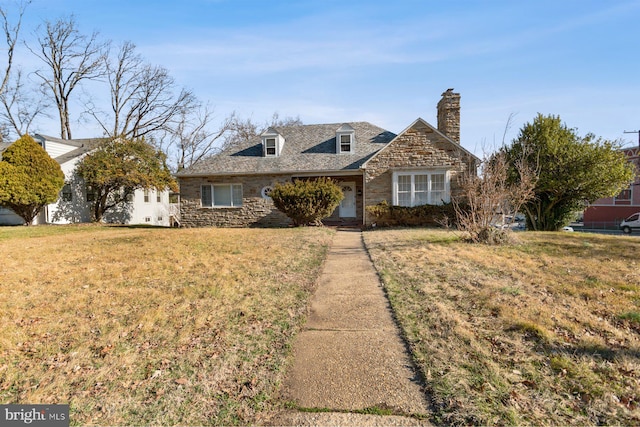 6901 Park Heights Ave, Baltimore, MD 21215 - view of front of house with stone siding, a chimney, and a front lawn