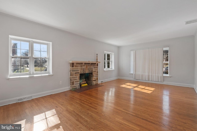6901 Park Heights Ave, Baltimore, MD 21215 - unfurnished living room with wood finished floors, a fireplace, and baseboards