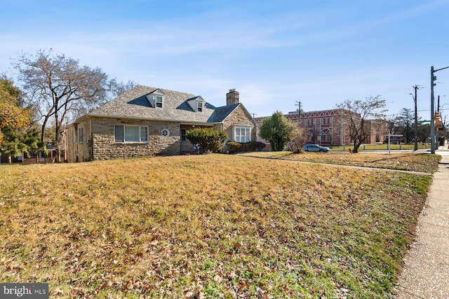 6901 Park Heights Ave, Baltimore, MD 21215 - new england style home with stone siding, a chimney, and a front yard