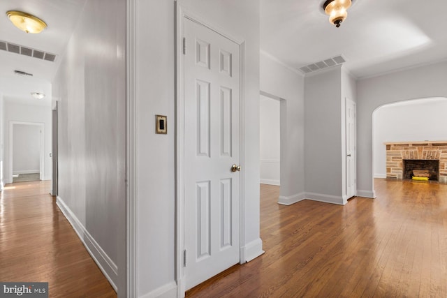 6901 Park Heights Ave, Baltimore, MD 21215 - corridor featuring wood-type flooring, baseboards, and ornamental molding