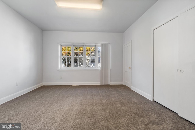 6901 Park Heights Ave, Baltimore, MD 21215 - unfurnished bedroom featuring carpet floors, baseboards, and a closet