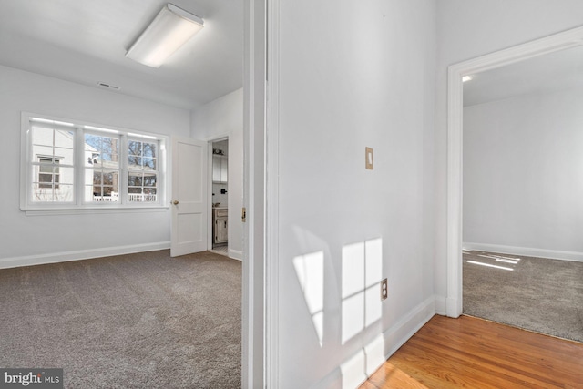 6901 Park Heights Ave, Baltimore, MD 21215 - hallway featuring carpet flooring and baseboards