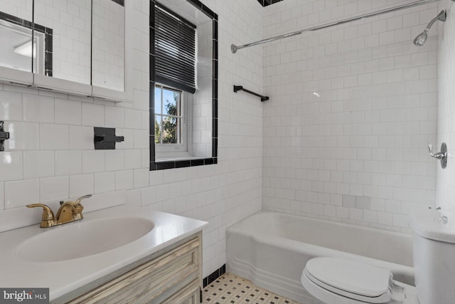 6901 Park Heights Ave, Baltimore, MD 21215 - full bath featuring toilet, tile walls, vanity, bathtub / shower combination, and backsplash