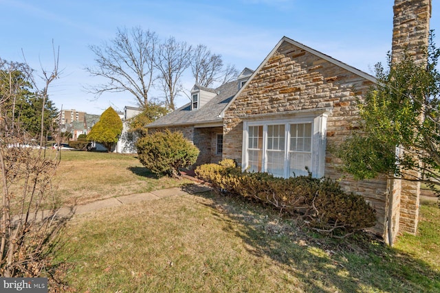 6901 Park Heights Ave, Baltimore, MD 21215 - view of home's exterior with stone siding and a lawn