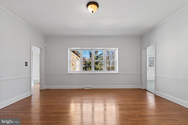 6901 Park Heights Ave, Baltimore, MD 21215 - spare room featuring crown molding, wood finished floors, and baseboards