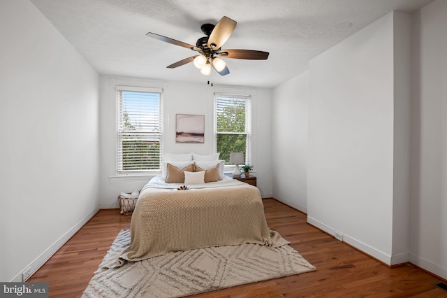 511 S E Ave, Baltimore, MD 21224 - bedroom with wood finished floors, baseboards, and ceiling fan
