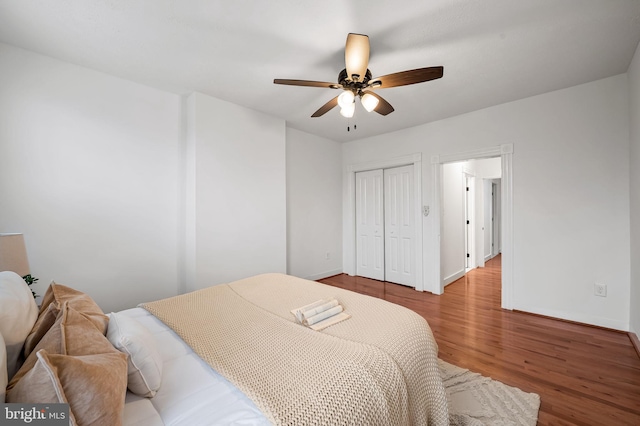 511 S E Ave, Baltimore, MD 21224 - bedroom with wood finished floors, baseboards, a closet, and a ceiling fan