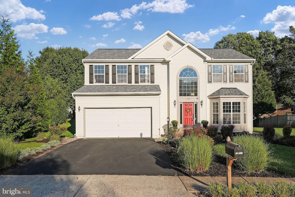 15737 Marbury Heights Way, Dumfries, VA 22025 - traditional-style house featuring driveway and an attached garage