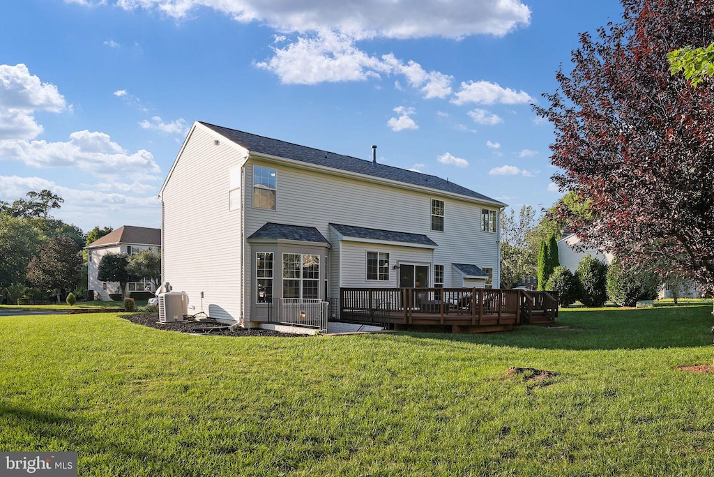 15737 Marbury Heights Way, Dumfries, VA 22025 - rear view of house featuring a wooden deck and a yard