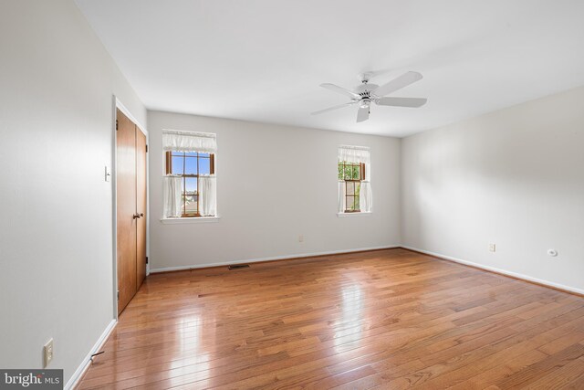 229 Bloomingdale Ave Unit 1, Wayne, PA 19087 - unfurnished room featuring healthy amount of natural light, light wood-style floors, a ceiling fan, and baseboards