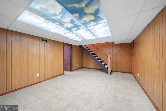 229 Bloomingdale Ave Unit 1, Wayne, PA 19087 - finished below grade area featuring a drop ceiling, stairs, wood walls, light floors, and baseboards