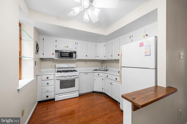 229 Bloomingdale Ave Unit 1, Wayne, PA 19087 - kitchen with white appliances, a sink, dark wood-style flooring, a ceiling fan, and white cabinetry