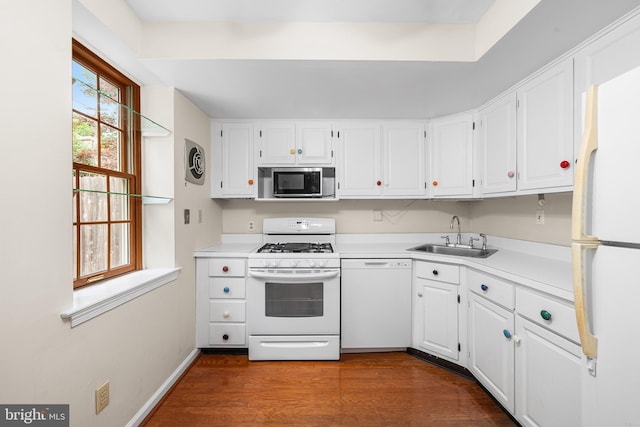 229 Bloomingdale Ave Unit 1, Wayne, PA 19087 - kitchen with white appliances, a sink, dark wood-style flooring, white cabinetry, and light countertops