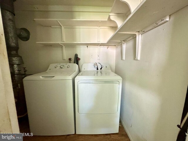 11 Cardinal St Unit D, Manchester, NJ 08759 - laundry room with washing machine and clothes dryer and wood finished floors