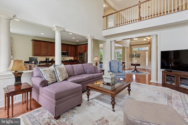 501 Jasmine Cir, Upper Gwynedd, PA 19446 - living area featuring ornate columns, light wood finished floors, a high ceiling, and recessed lighting