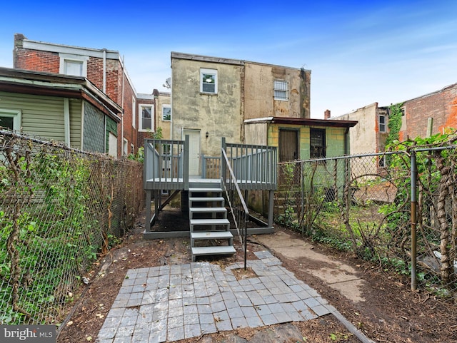 320 E Shedaker St, Philadelphia, PA 19144 - rear view of property featuring a wooden deck, a fenced backyard, and stairway