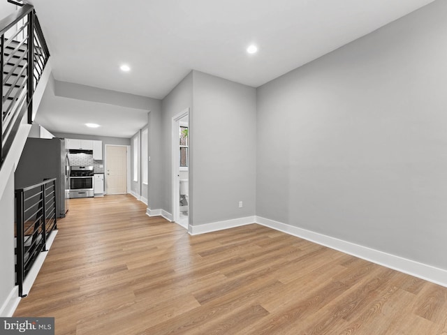 320 E Shedaker St, Philadelphia, PA 19144 - unfurnished living room featuring baseboards, recessed lighting, and light wood-style flooring