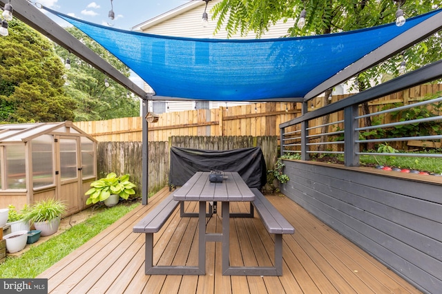 6109 Houston Ct, Alexandria, VA 22310 - wooden terrace featuring an exterior structure, an outbuilding, and outdoor dining area