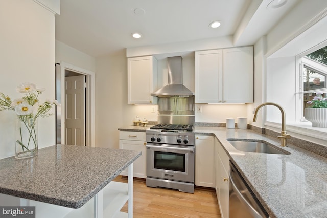 1312 Michigan Ave, Alexandria, VA 22314 - kitchen with stainless steel appliances, wall chimney exhaust hood, a sink, light wood-style flooring, and light stone counters