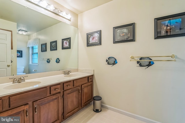 550 Font Rd, Downingtown, PA 19335 - bathroom with toilet, tile patterned floors, double vanity, and baseboards