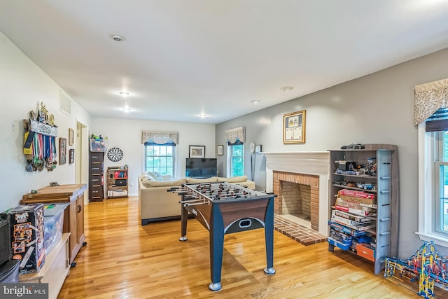 550 Font Rd, Downingtown, PA 19335 - rec room with light wood finished floors and a fireplace