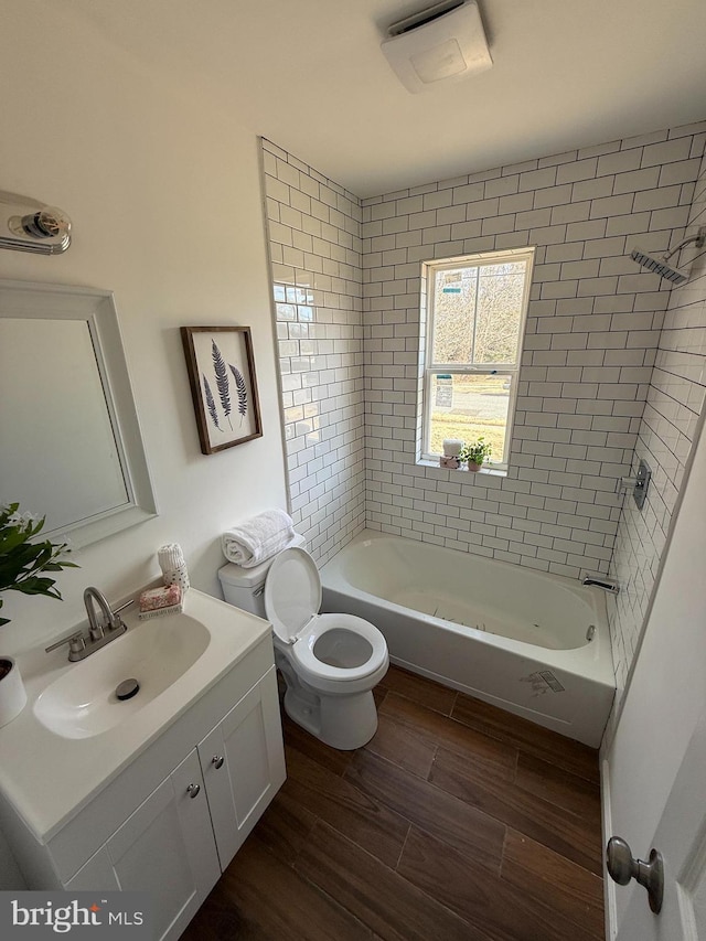 943 Columbus Rd, Burlington, NJ 08016 - full bath featuring toilet, vanity, wood finished floors, and shower / tub combination