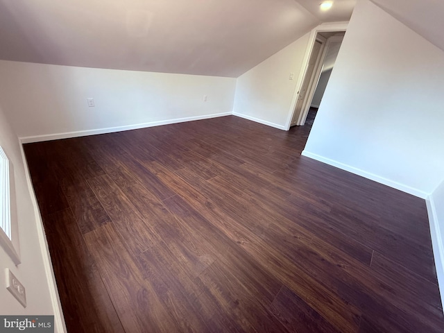 943 Columbus Rd, Burlington, NJ 08016 - additional living space featuring vaulted ceiling, dark wood-style floors, and baseboards