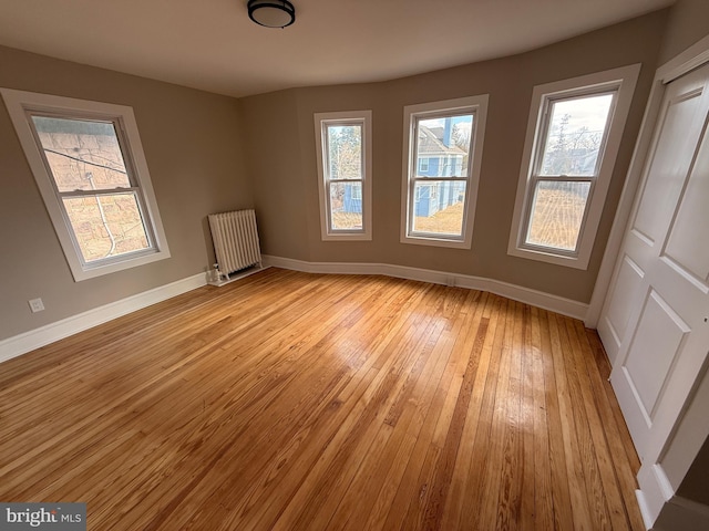 943 Columbus Rd, Burlington, NJ 08016 - unfurnished room featuring radiator, baseboards, and light wood-type flooring