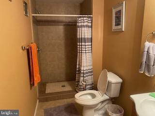 11306 Bent Creek Ter, Germantown, MD 20876 - full bath featuring toilet, tiled shower, vanity, and tile patterned flooring