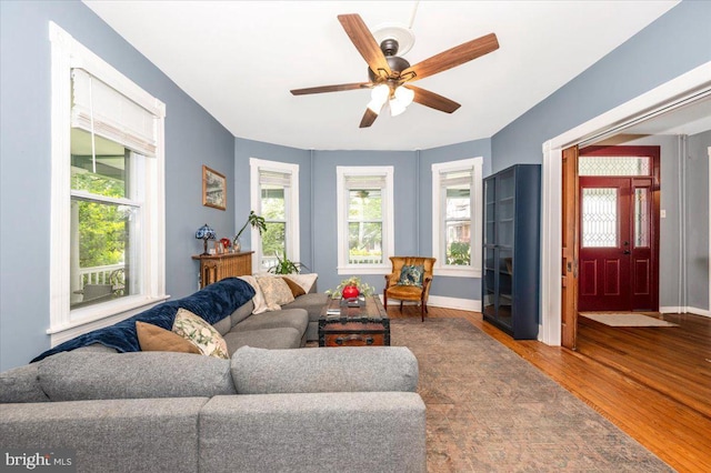 28 N Altamont Ave, Thurmont, MD 21788 - living room featuring wood finished floors, a ceiling fan, and baseboards