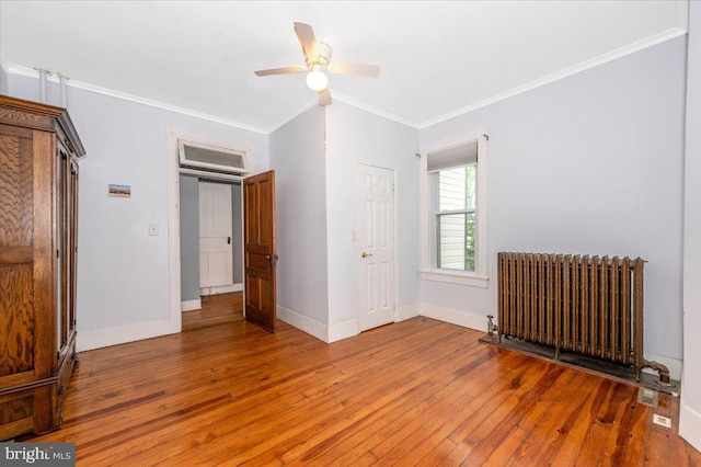 28 N Altamont Ave, Thurmont, MD 21788 - unfurnished bedroom featuring radiator heating unit, light wood-style floors, ornamental molding, baseboards, and ceiling fan