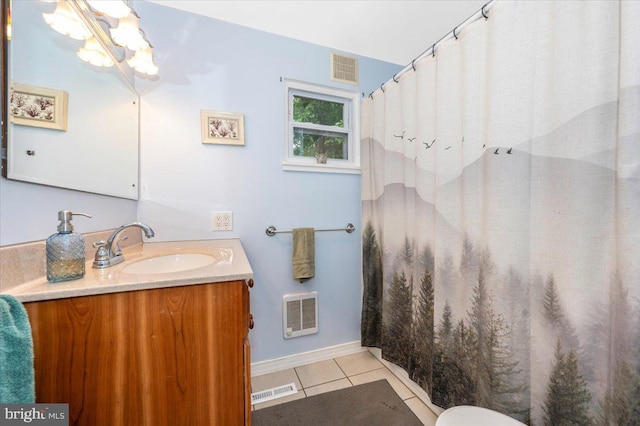 28 N Altamont Ave, Thurmont, MD 21788 - full bath with vanity, tile patterned flooring, baseboards, a chandelier, and toilet