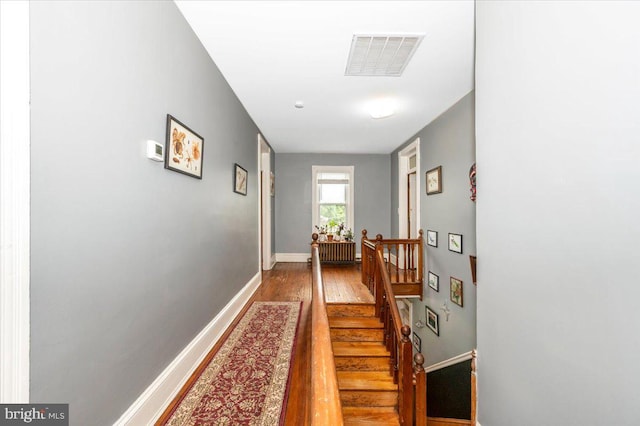 28 N Altamont Ave, Thurmont, MD 21788 - corridor with wood finished floors, radiator heating unit, baseboards, and stairs
