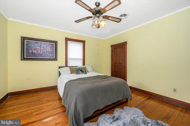28 N Altamont Ave, Thurmont, MD 21788 - bedroom featuring baseboards, wood-type flooring, crown molding, and a ceiling fan