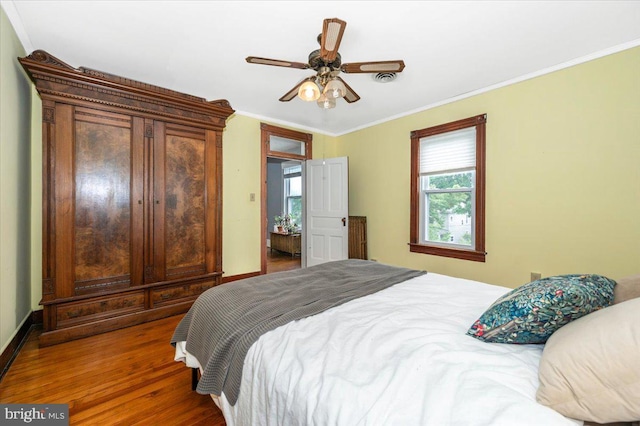 28 N Altamont Ave, Thurmont, MD 21788 - bedroom featuring ornamental molding, wood finished floors, a ceiling fan, and baseboards